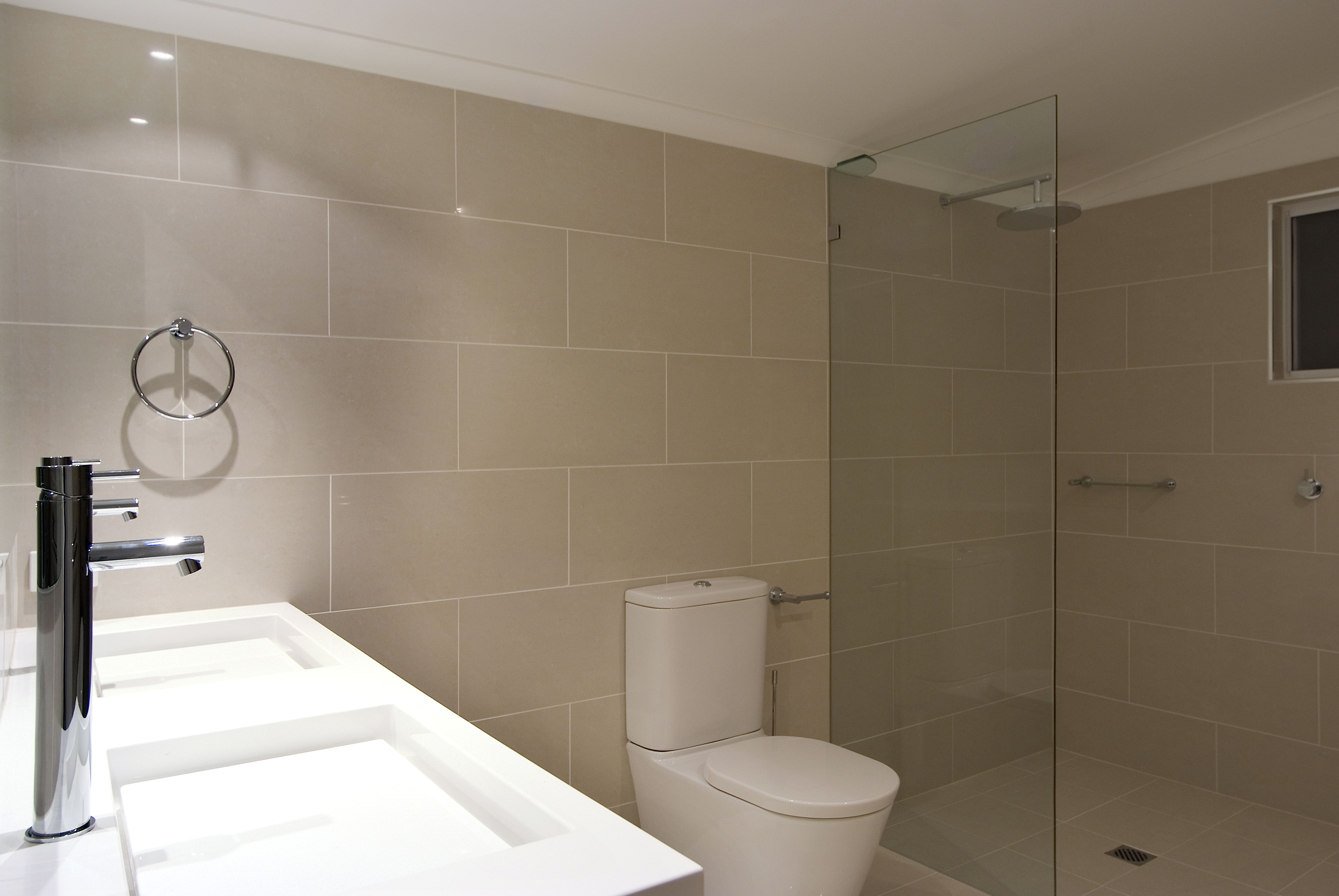 Clayfield main bathroom close up vanity, toilet suite, frameless glass panel