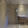 Hawthorne bathroom renovation twin shower frameless glass panel