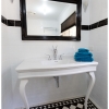 Black and white floor tiling swan vanity spout white traditional console