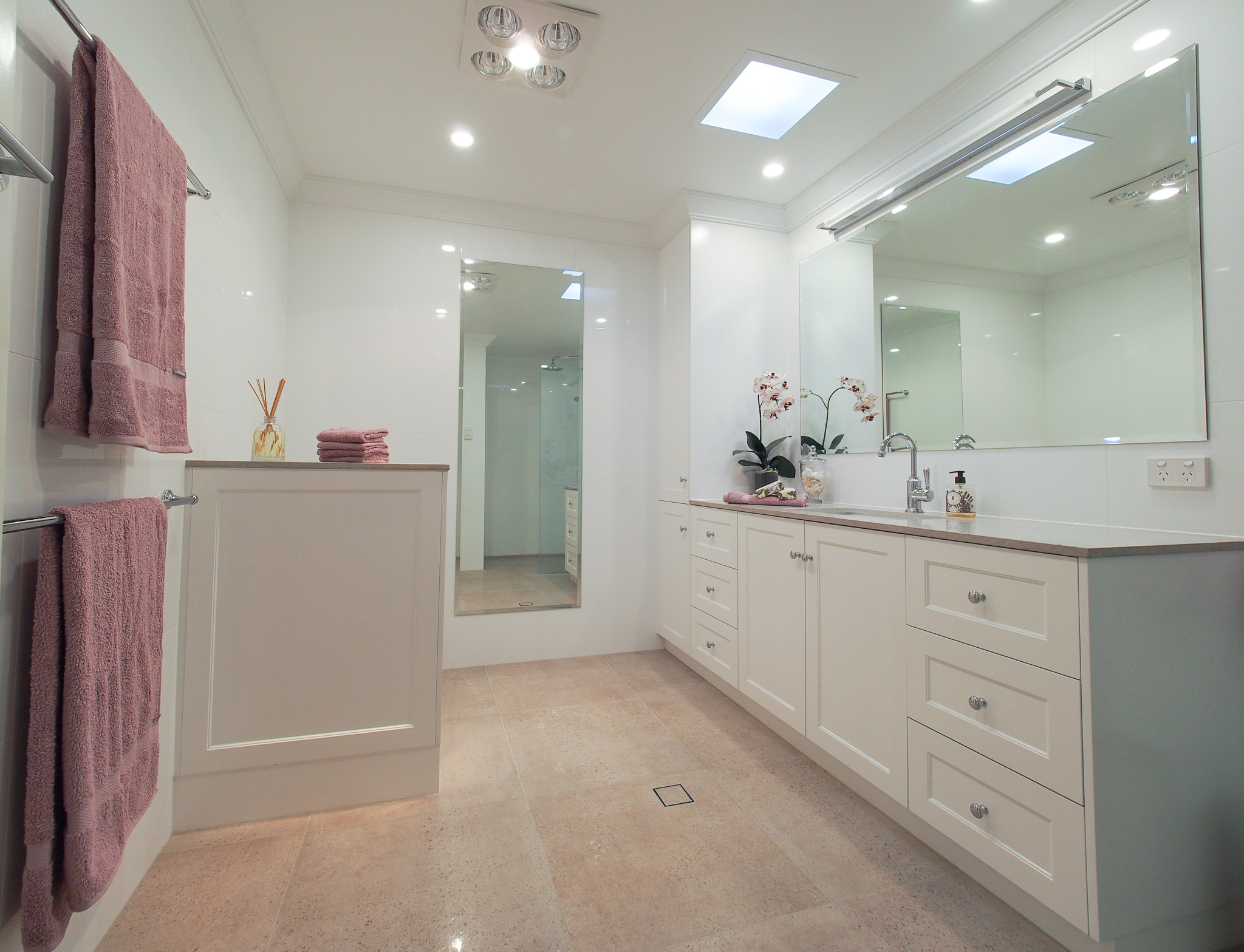 Bathroom wide angle - nib wall to conceal toilet suite, full-length mirror, custom vanity and linen cupboard