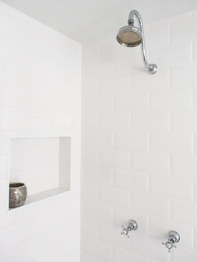 Gooseneck-shower-head-recessed-wall-niche-beveled-edge-subway-tiles