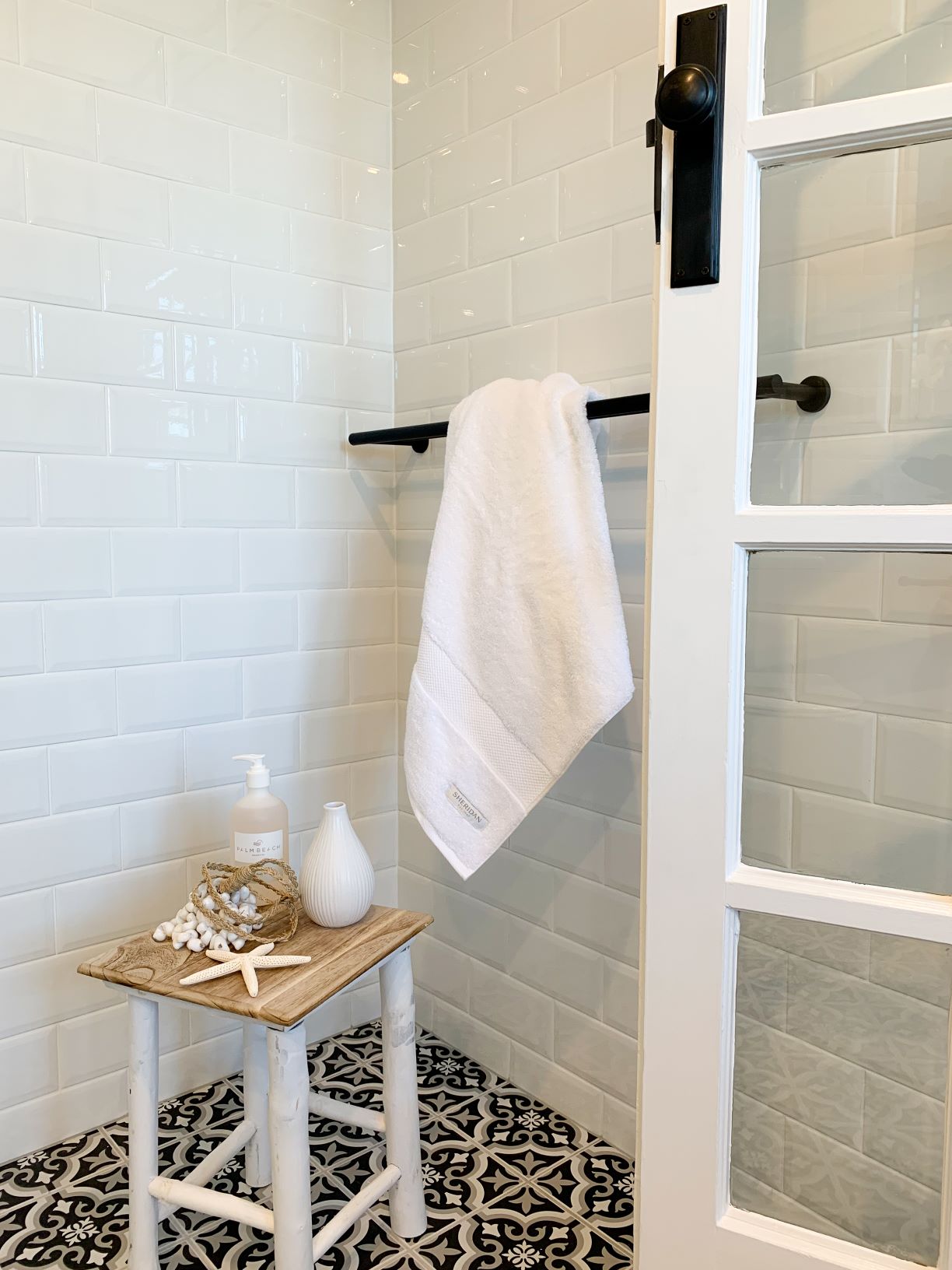 ascot ensuite white wall tiles black and white floor tiles french doors towel rail