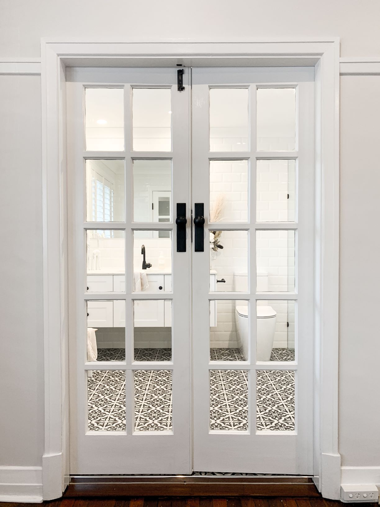 ascot ensuite french doors black and white floor tiles