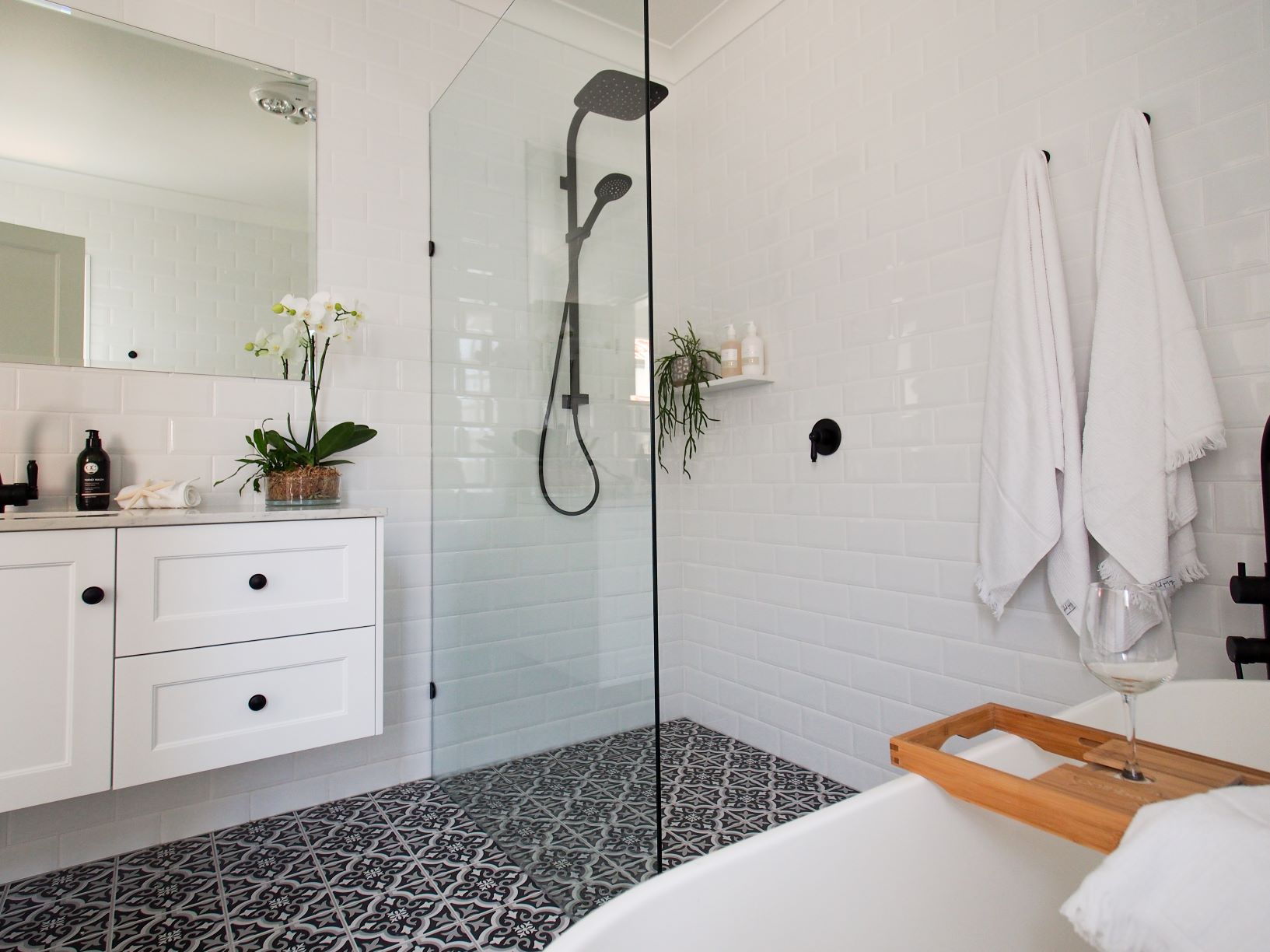 ascot main bathroom black and white floor tiles shower screen rain shower vanity free standing bath white wall tiles